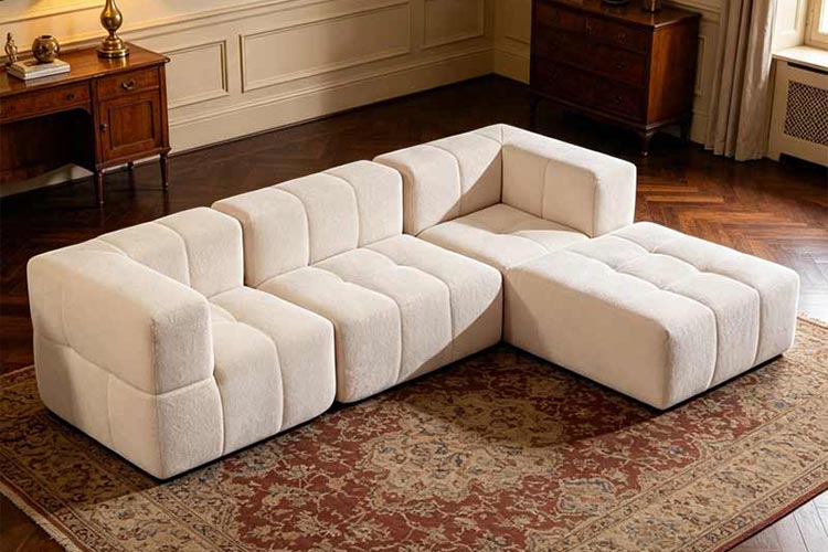 Cream modular sectional sofa with a chaise in a living room